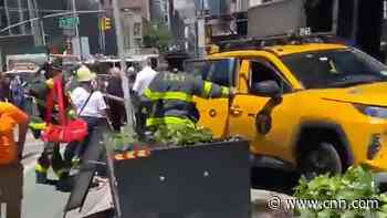 6 people hospitalized after taxi jumps curb in New York City, NYPD says
