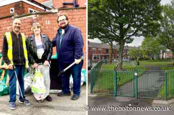 Morris Green residents holding litter pick for war memorial