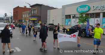 Community Living Braves Rainy Weather for Special Olympics Torch Run - renfrewtoday.ca