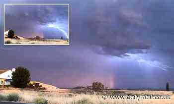 Amazing footage shows a rainbow shining and lightning bolts flashing at the same moment