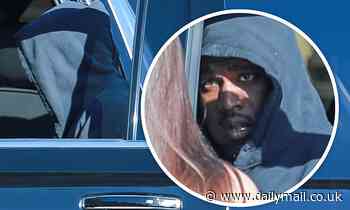 Kanye West keeps a low profile in a black hoodie and slides as he leaves Nobu in Malibu - Daily Mail