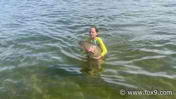 11-year-old girl catches huge carp with her bare hands in Lake Minnetonka - FOX 9 Minneapolis-St. Paul