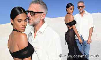 Tina Kunakey looks sensational as she poses in a backless sheer dress with husband Vincent Cassel