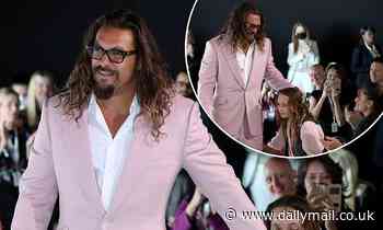 Jason Momoa cuts a dapper figure in a pink suit as he spends time with his children in Portugal