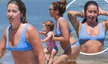 Ashley Tisdale hits the beach with daughter Jupiter, one, and husband Christopher French in Malibu