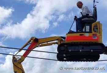 World-first stunt for driving digger across a tightrope