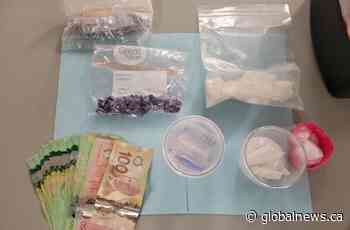 Handgun, cash and illicit drugs seized from stolen vehicle in Surrey, B.C.