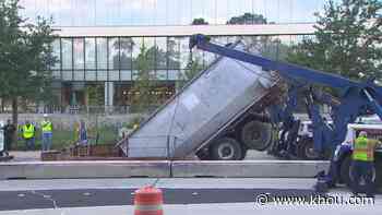 Dump truck falls into giant hole in west Houston - KHOU.com