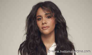 Alex Scott surprises in V-neck mini dress - and most daring platform heels - HELLO!