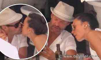 Ryan Seacrest and girlfriend Aubrey Paige pack on the PDA during a lunch outing in Ibiza