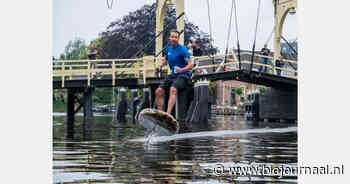 Plastic Soup Surfer surft 385 kilometer van Brussel naar Amsterdam op wegwerpbeker-surfboard - BioJournaal.nl