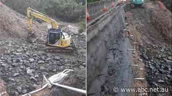 Isolated town's major link restored as threat of more damage looms