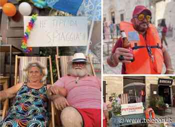 Un lido nel centro storico, benvenuti a 'Putignano a mare': cento persone in piazza con sdraio e ombrelloni - Telebari