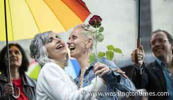 Couples wed as Swiss same-sex marriage law takes effect