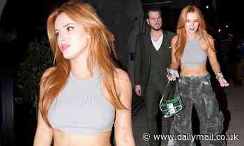 Newly single Bella Thorne flashes her taut abs in as she enjoys dinner with a mystery man - Daily Mail