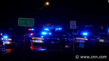Sheriff calls man suspected of fatally shooting two law enforcement officers 'a terrorist on a mission'