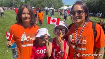 Regina residents wear red, white and orange to celebrate Canada Day