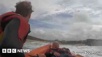 Lifeguards in Cornwall rescue surfer caught in rip current - BBC