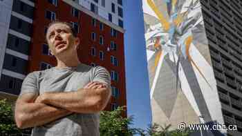 Graffiti artist completes world's tallest mural in downtown Calgary