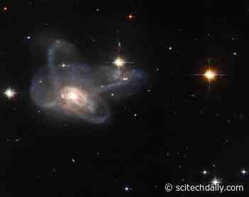 Hubble Spies a Galactic Gem: Unusual Multi-Armed Galaxy Merger