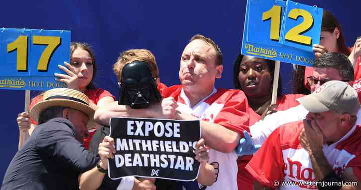 Joey Chestnut Puts Animal Rights Protester in Headlock While Winning Hot Dog Eating Contest by 20 Hot Dogs