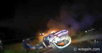 Dash cam video: Greenfield officers pull teen from a burning car crash - WIBQ