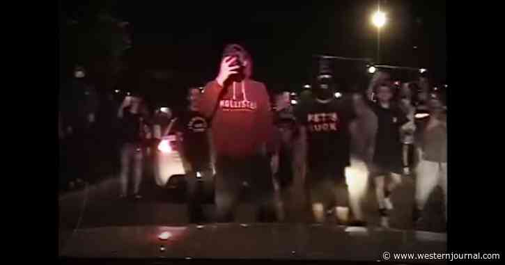 'Holy S***': State Trooper Ambushed by Mob Pelting Squad Car with Firecrackers, Shattering Glass