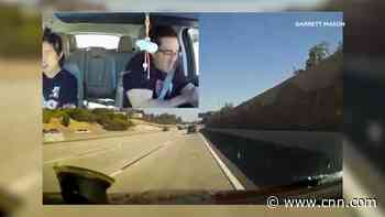 See the moment a couple get caught in a freeway shootout