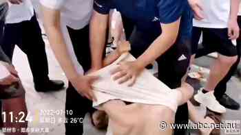 'The banks are breaking the law': Chinese protesters demanding frozen millions dragged away by security