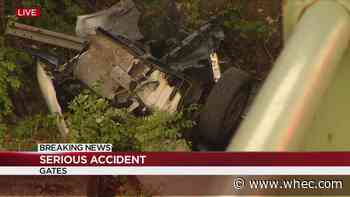 Van flips over side of bridge in Gates