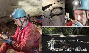 Cavers discover a 200-year-old min shaft containing pipes, shoes and inscriptions left by miners