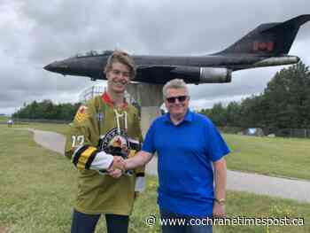 Long signs with Powassan Voodoos - Cochrane Times Post