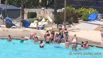 Video captures the moment a dust devil tore by a Las Vegas hotel pool