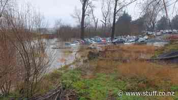 Councils investigate after Milton car wrecker leaves vehicles in flood waters - Stuff