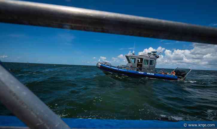 Airmen rescue 8 from capsized boat circled by shark