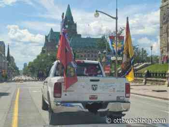 Flag-waving pickup truck fined more than $1,000 for trip along Wellington Street