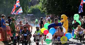 Wacky racers dash through streets of usually quiet village as legendary Braughing Wheelbarrow Races return - Herts Live