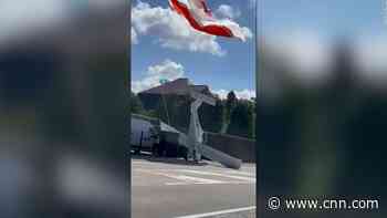 Video: Pilot deploys parachute, plane crashes into sidewalk outside Bruges