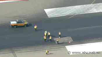 London airport forced to suspend flights after extreme heat leaves 'defects' in runway