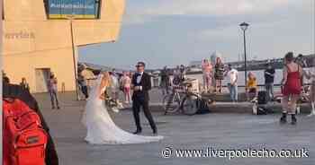 Newly married couple beam as they dance outside Liver Building - Liverpool Echo