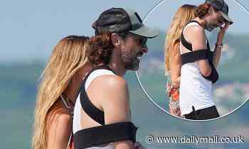 Adrien Brody nurses injured arm while enjoying sunny getaway to St Tropez with his girlfriend 