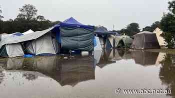 'Splendour in the mud': Wild weather causing chaos at NSW music festival