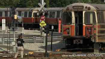 Fire on Massachusetts train prompts rescue of passenger who jumped off bridge into river