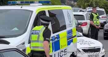 Barrhead crowd bawls abuse as police escort man from house amid angry protest - Glasgow Live