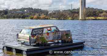 Robert Fielding's Holden On floating on Lake Burley Griffin as part of 4th National Indigenous Art Triennial: Ceremony - The Canberra Times
