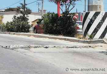 Advierten por levantamiento de asfalto en Bulevar Geranos - Ensenada.net