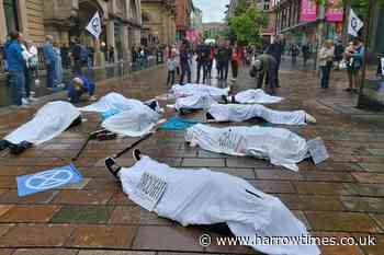 Climate activists stage 'die-in' protest in Glasgow following record temperatures - Harrow Times