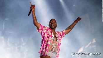 Rapper storms off stage after hecklers throw objects at him