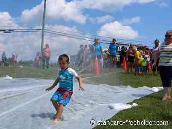 Families slide into fun at St. Andrews West slip'n'slide - Cornwall Standard-Freeholder