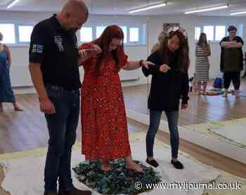 Rhyl entrepreneur raises more than £1000 by walking on broken glass - Rhyl Journal